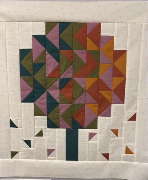 Colorful quilted tree pattern with geometric leaf design