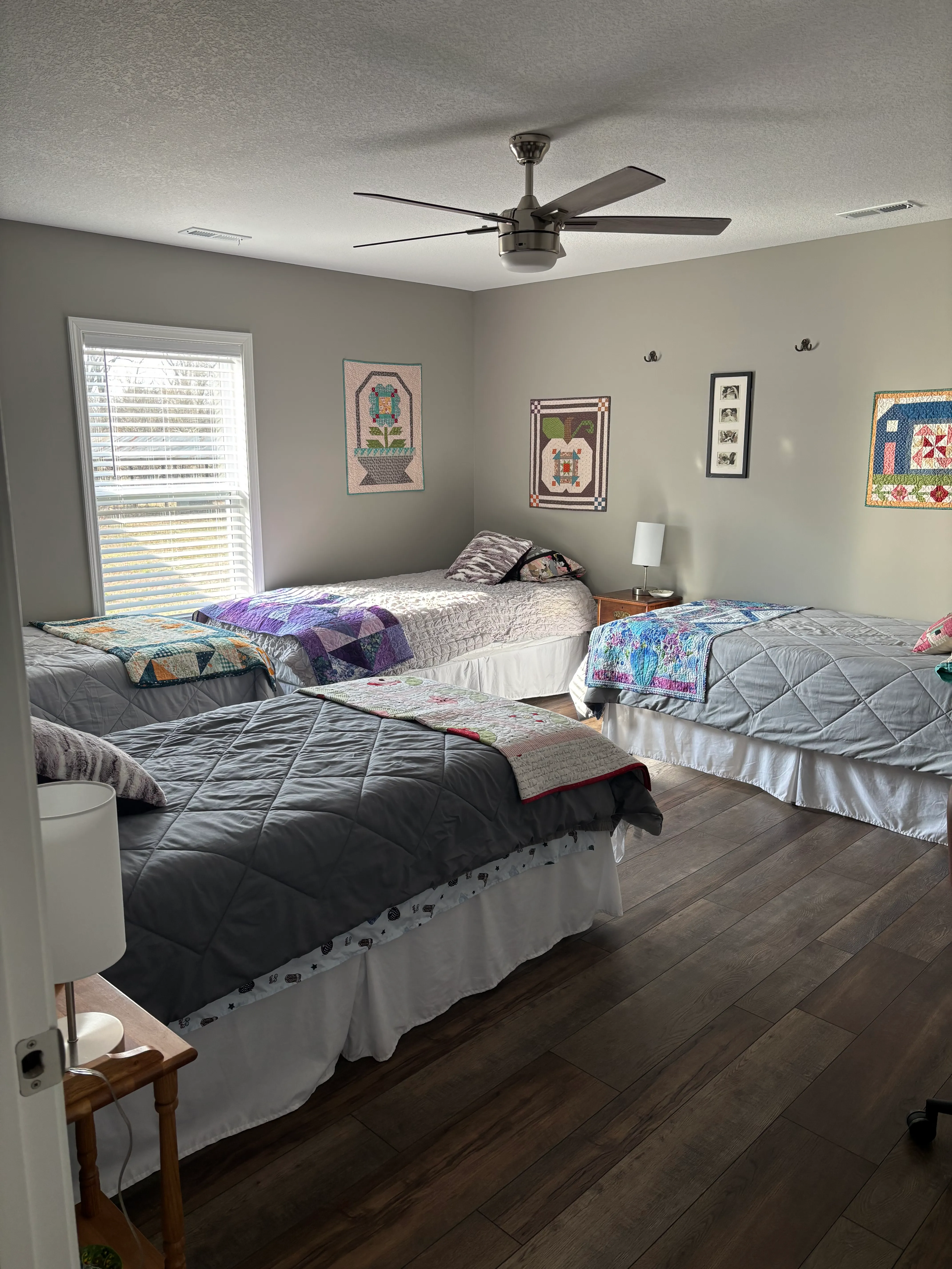 Bedroom with comfortable beds and handmade quilted bedding at the retreat
